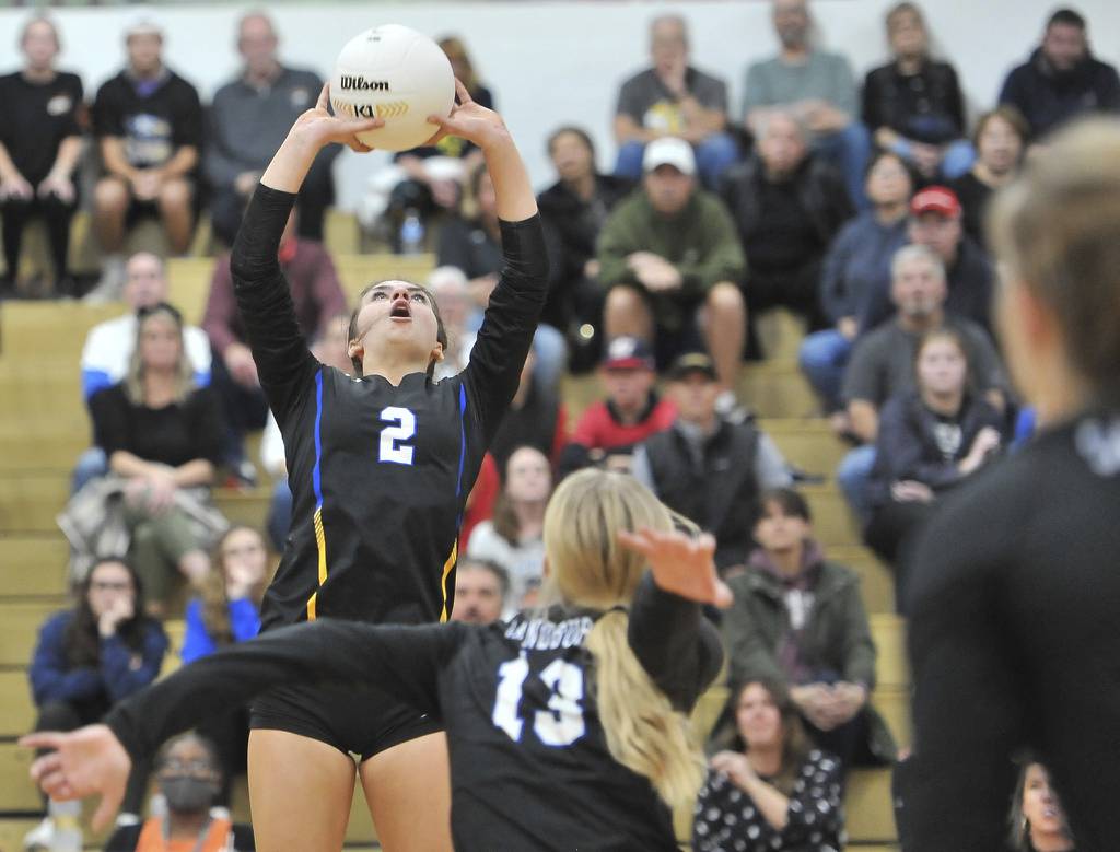 Sandburg's Keira Fitzgerald (2) sets the ball for Elise Sterling (13) against Lincoln-Way East during an Class 4A Lockport Sectional semifinal match on Monday, October 31, 2022.