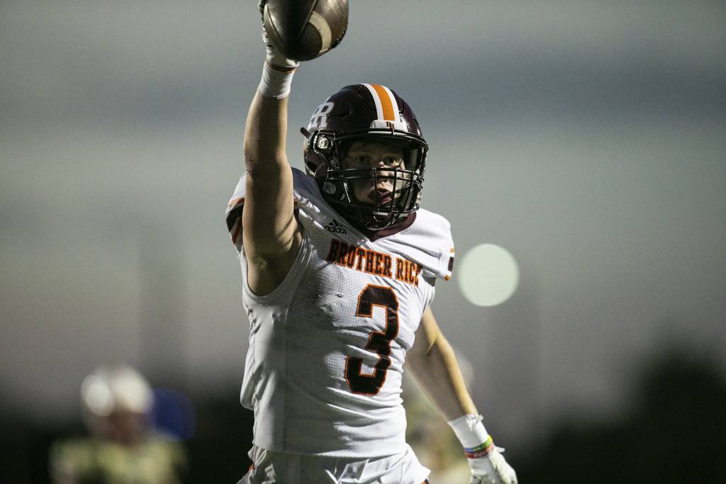 Brother Rice wide receiver Marty O'Keeffe (3) holds up the ball after scoring on a reception against St. Rita during a game in Chicago on Friday, Sept. 2, 2022.