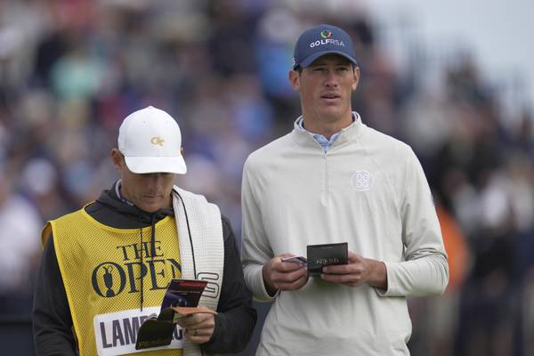 South Africa's Christo Lamprecht checks the yardage on the fourth hole on the first day of the British Ope at Royal Liverpool on Thursday, July 20, 2023, in Hoylake, England.