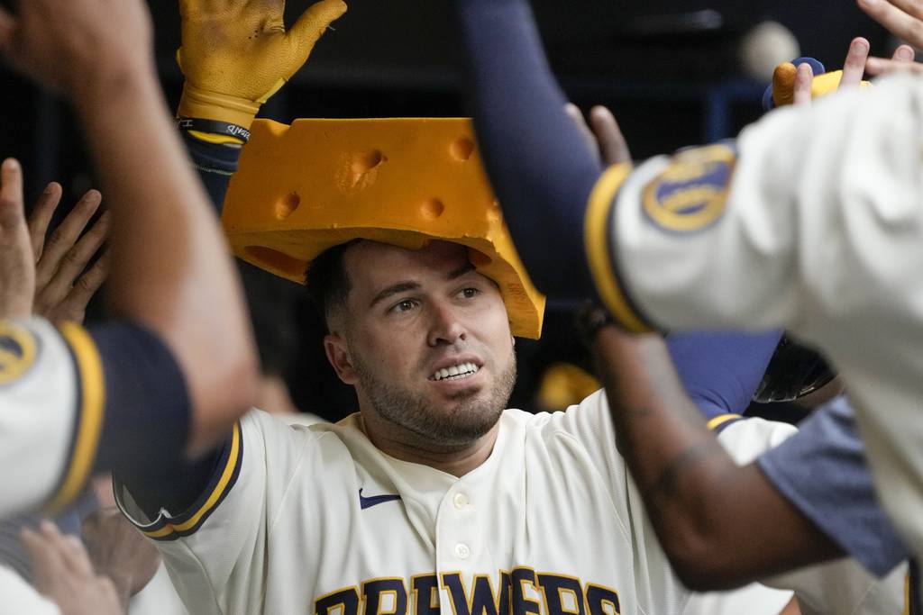 The Brewers' Victor Caratini is congratulated after hitting a home run during the eighth inning against the Cubs on Thursday, July 6, 2023, in Milwaukee.