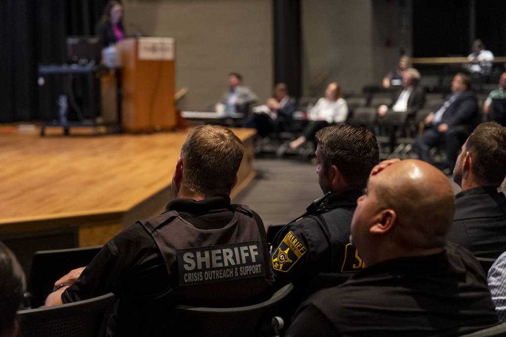 Law enforcement officers and others listen as Elizabeth Leahy, of the Firearms Safety Council, conducts a training seminar on June 26, 2023, at College of Lake County in Grayslake on the state's firearms restraining order and clear and present danger report procedures.