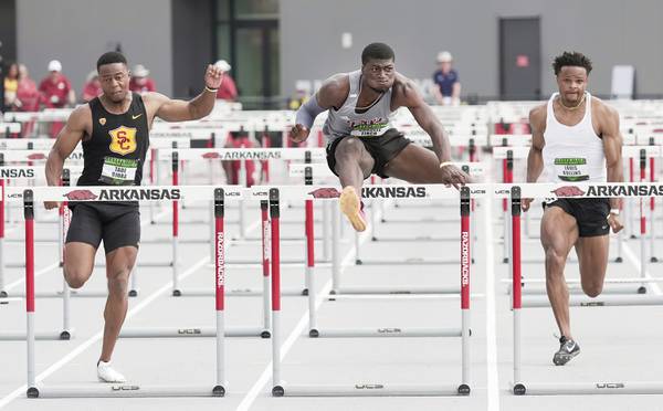 Pittsburg State hurdler Cordell Tinch, center, competing against Tade Ojora and Louis Rollins in the 110m hurdles final at the Arkansas Grand Prix on June 23, 2023.