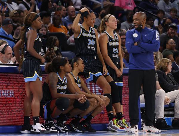Sky coach James Wade talks with players before switching out starters in the final minutes of the fourth quarter against the Mystics at Wintrust Arena on Aug. 5, 2022.