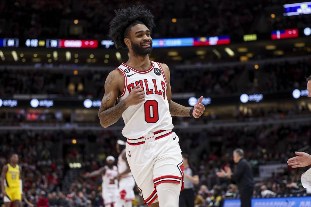 Bulls guard Coby White smiles during the third quarter against the Pacers at the United Center on March 5, 2023.