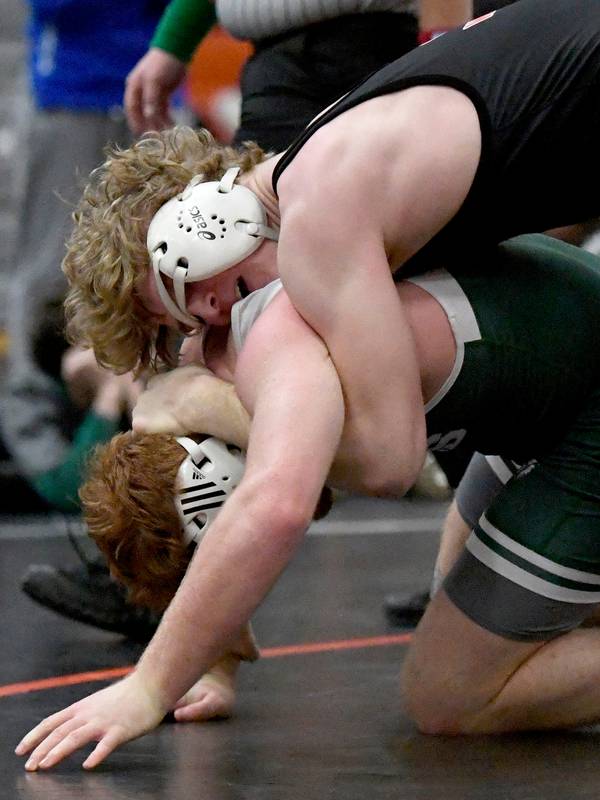 Libertyville’s Caleb Baczek, top, wrestles against Grayslake Central’s Matty Jens during a match in the 182-pound weight class at the Lake County Invitational in Libertyville on Saturday, Jan. 21, 2023.