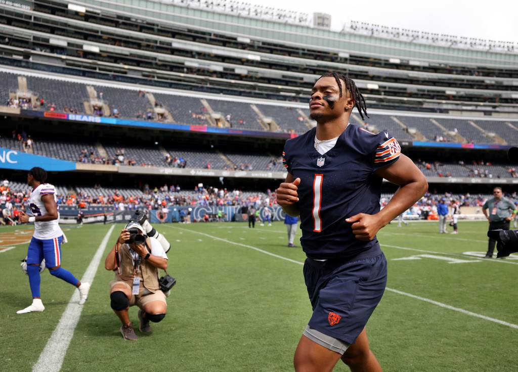 Bears quarterback Justin Fields runs to the locker room after a preseason game against the Bills on Saturday at Soldier Field. 