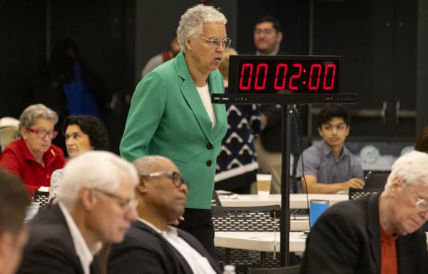 Cook County Board President Toni Preckwinkle walks the room during a Cook County Democrats slating meeting on Aug. 15, 2023.