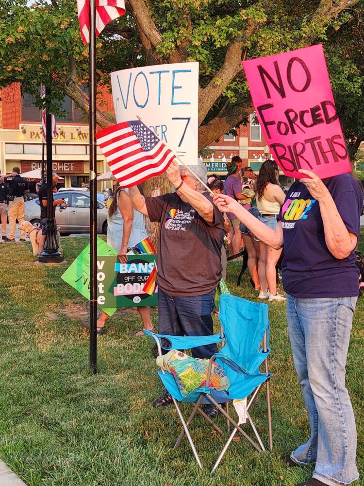 Protesters of Indiana's abortion ban listen to speakers at a Northwest Indiana NOW vigil on the courthouse lawn in Valparaiso Monday evening.