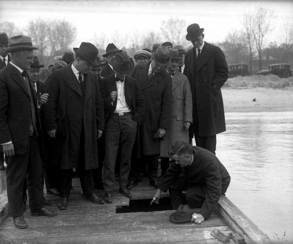 Assistant State’s Attorney Roy Fairbanks shows members of the grand jury where the body of Leighton Mount was found in 1923. Mount, a Northwestern University freshman, had been missing since 1921 after a hazing event at the school.