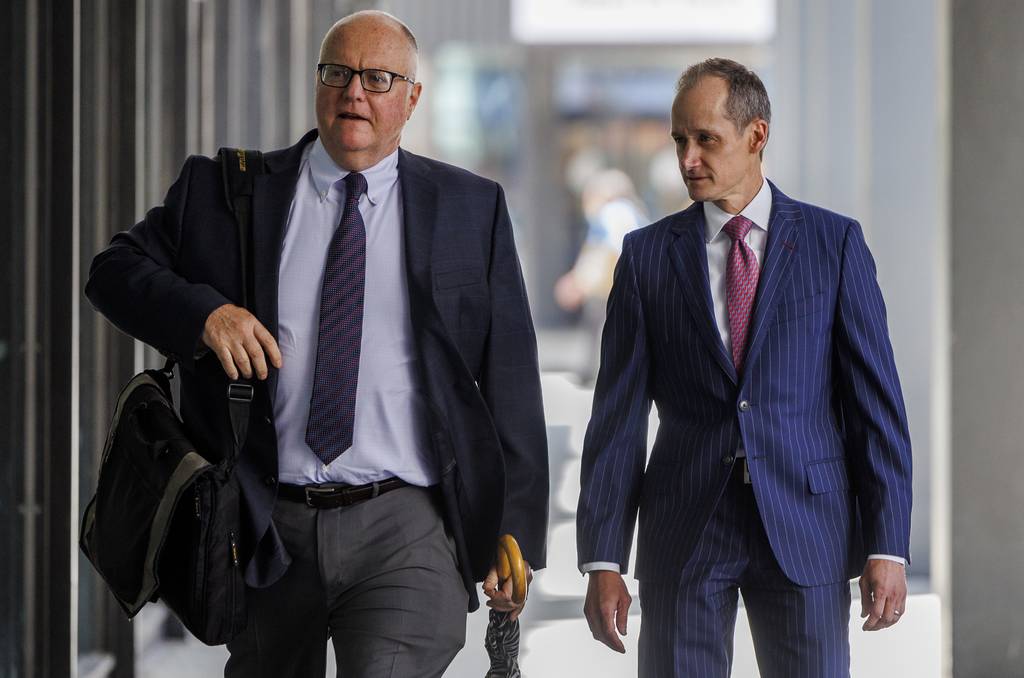 From right, Will Cousineau, a former top aide to House Speaker Michael Madigan, arrives at the Dirksen U.S. Courthouse on Aug. 15, 2023.