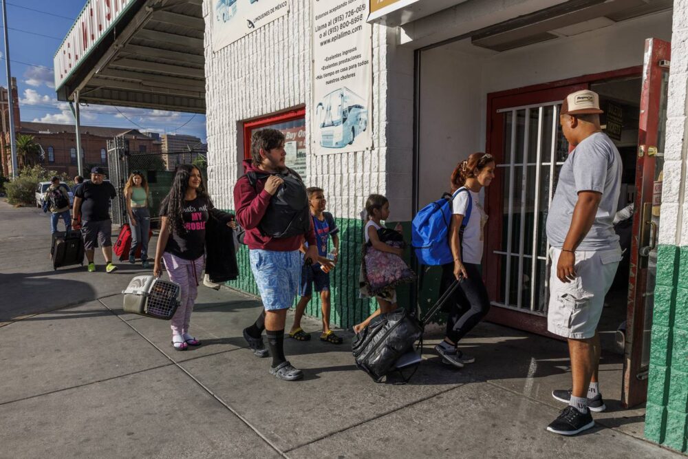 Esperanza Mendez walks into the Los Limousines bus station with her children Yuledy Mendez, 10, Pedro Mendez, 9, Fabian Mendez, 19, and Fabian's girlfriend Yolexi Cubillan, 19, before taking an 11-hour bus ride to Denver from El Paso, Texas, on July 13, 2023. 