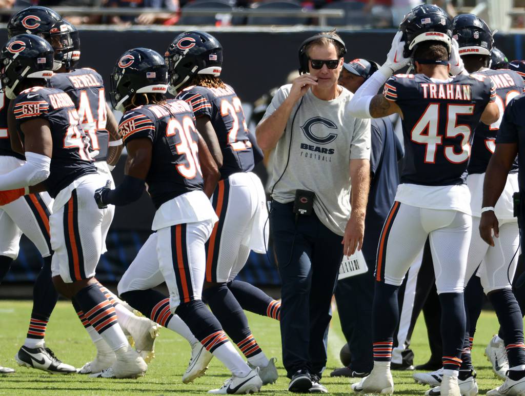 Bears coach Matt Eberflus walks between players in the fourth quarter of a preseason game against the Titans on Aug. 12 at Soldier Field. 