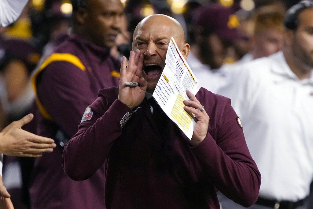 Minnesota coach P.J. Fleck yells to the defense during the first half of the team's Guaranteed Rate Bowl against West Virginia on Dec. 28, 2021.