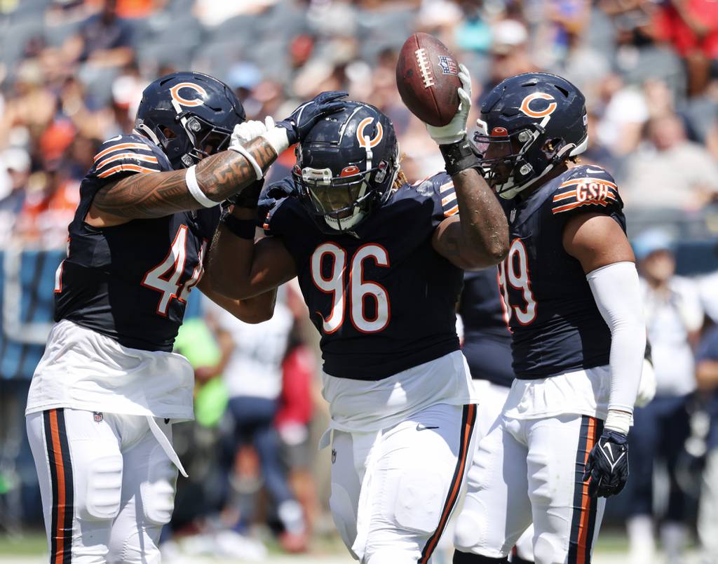 Chicago Bears defensive tackle Zacch Pickens celebrates after recovering a fumble against the Tennessee Titans in the second quarter of a preseason game at Soldier Field on Aug. 12, 2023.