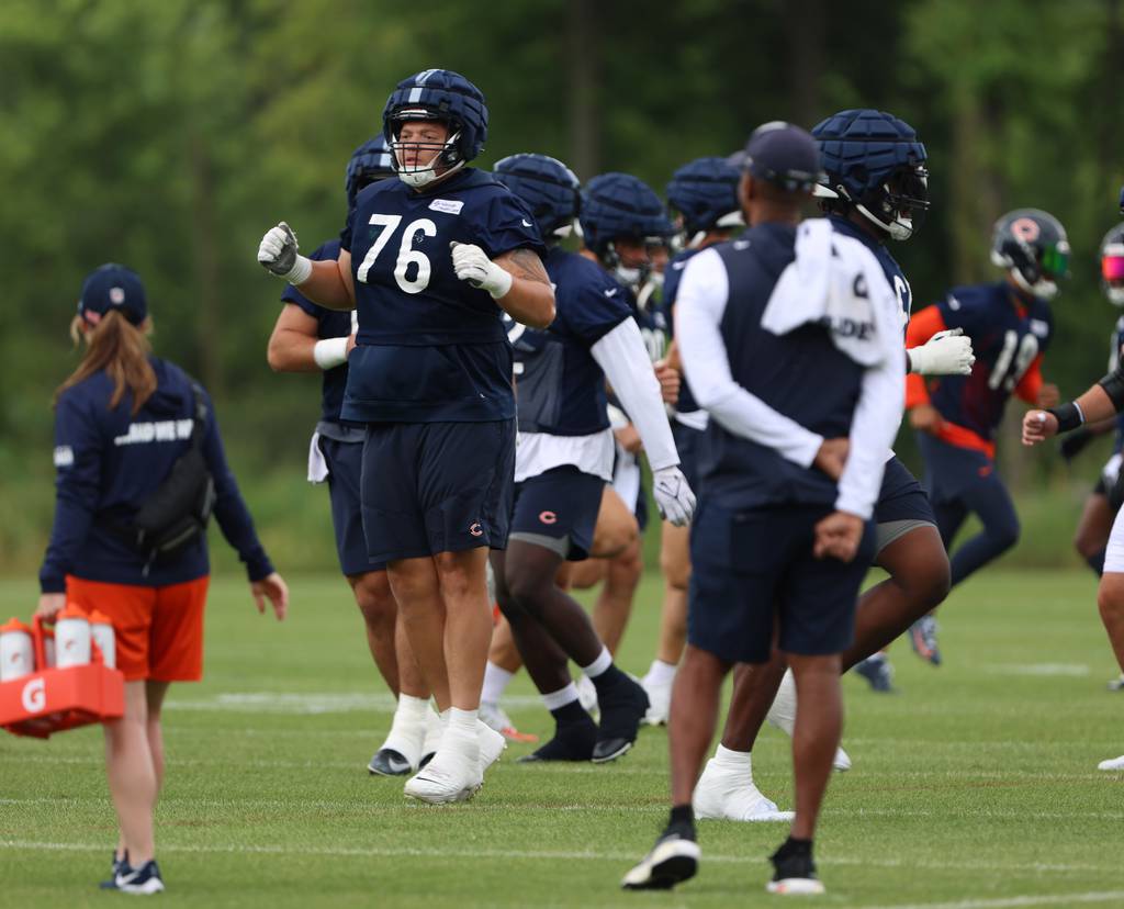 Chicago Bears offensive tackle Teven Jenkins warms up during training camp on July 29, 2023.