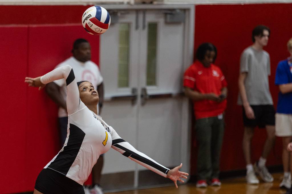 Marian Catholic's Carrington Smith (1) serves Homewood-Flossmoor during a nonconference match in Flossmoor on Thursday, Aug. 24, 2023.