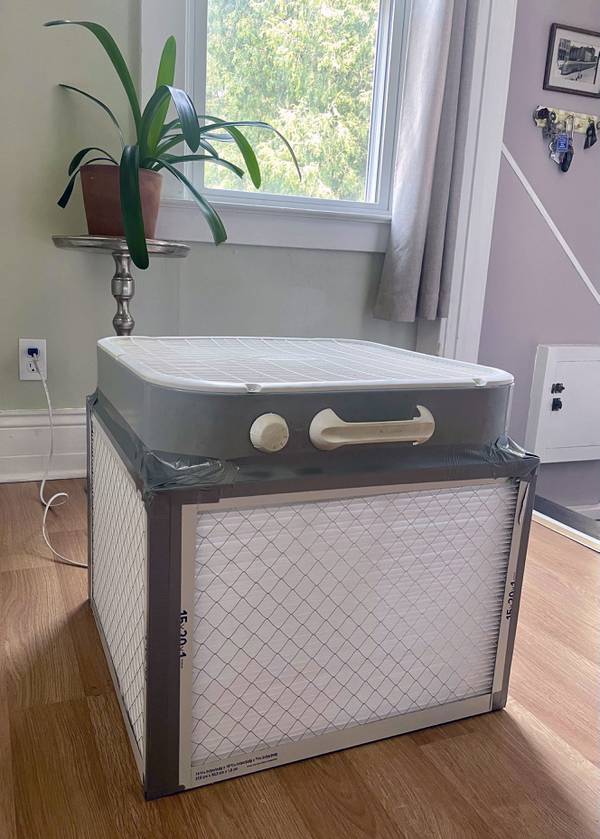 A Corsi-Rosenthal air purifier built by Liz Hradil is seen at her home in Syracuse on June 7, 2023, after the wildfire smoke covered much of New York. The method involves taping four air filters together with a box fan. Experts say the DIY method is highly effective against filtering air indoors against wildfire smoke. 