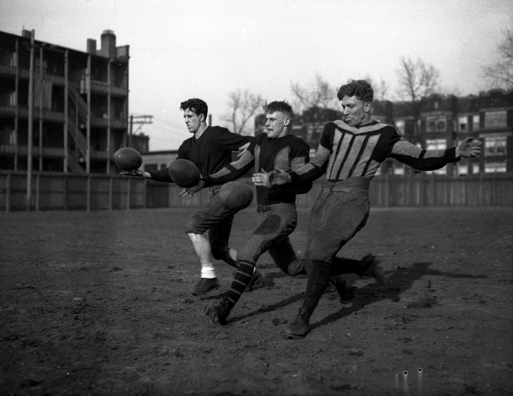 Captain Donald Birney, Bennie Johnson and P.J. Jaigo during football practice at spring training for the University of Chicago, circa 1932.