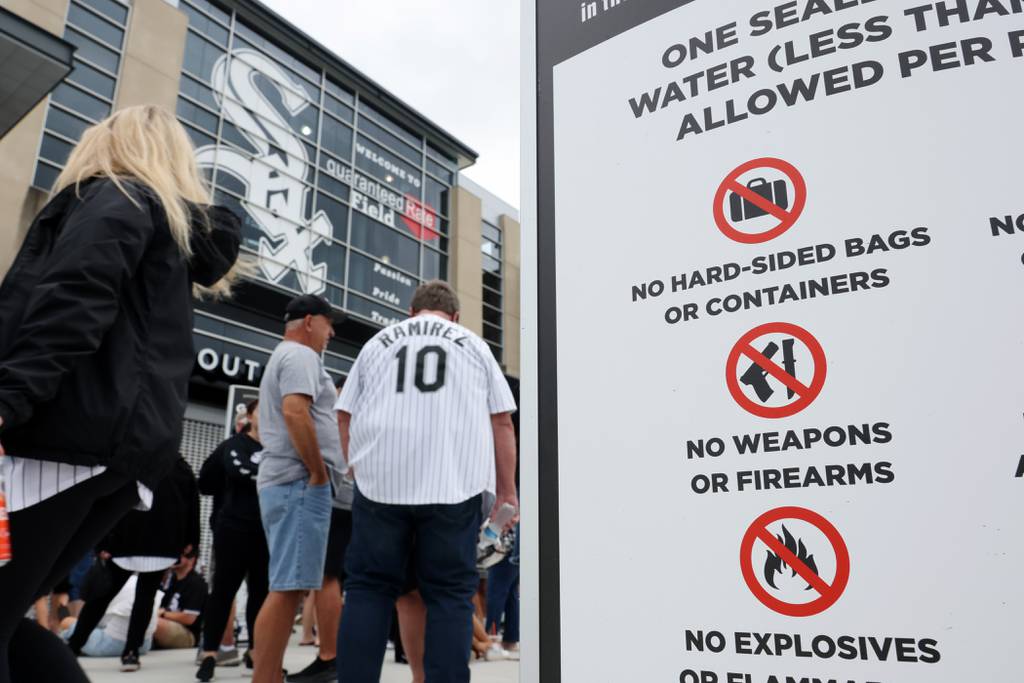 Signs informing fans of prohibited items are displayed at an entrance to Guaranteed Rate Field before a game between the White Sox and Athletics on Saturday. 