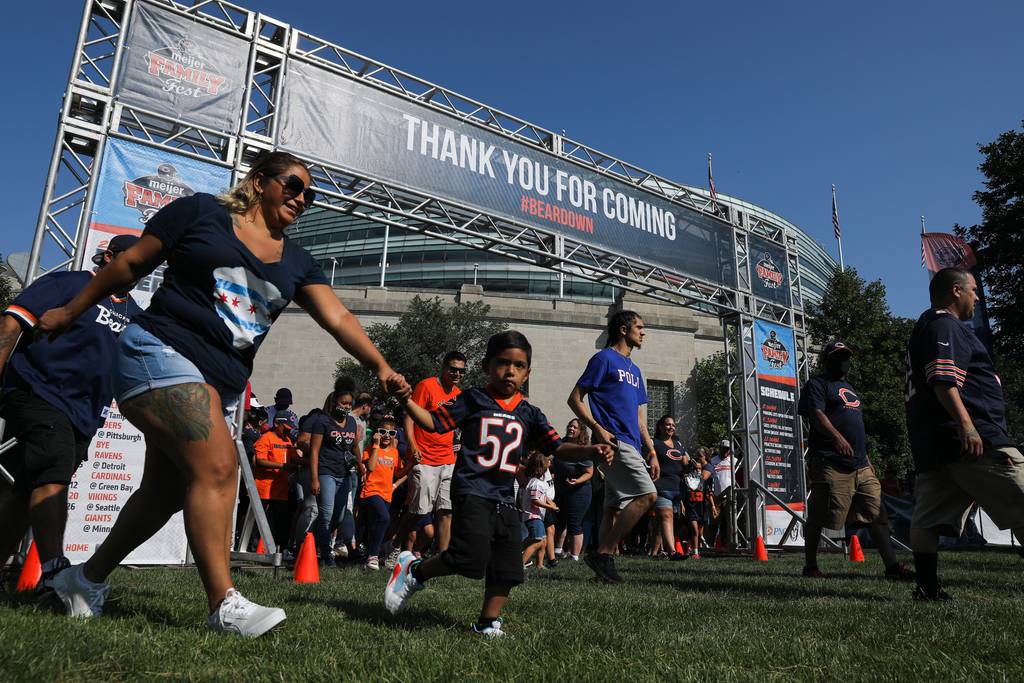 Fans make their way into the Chicago Bears Family Fest area outside of Soldier Field as the gates officially open on Aug. 3, 2021.