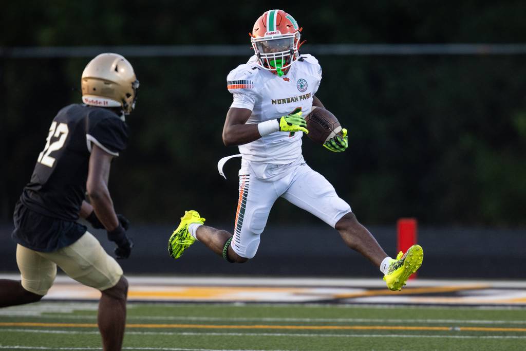 Morgan Park's Tysean Griffin (1) jump steps while trying to elude a Richards defender during a nonconference game in Oak Lawn on Friday, Aug. 25, 2023.
