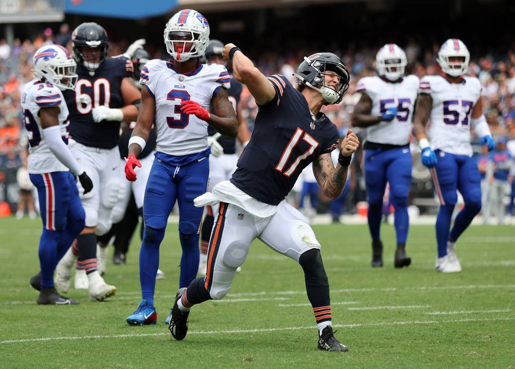 Bears quarterback Tyson Bagent (17) celebrates in front of Bills safety Damar Hamlin after converting a big first down the second quarter of a preseason game Saturday at Soldier Field. 