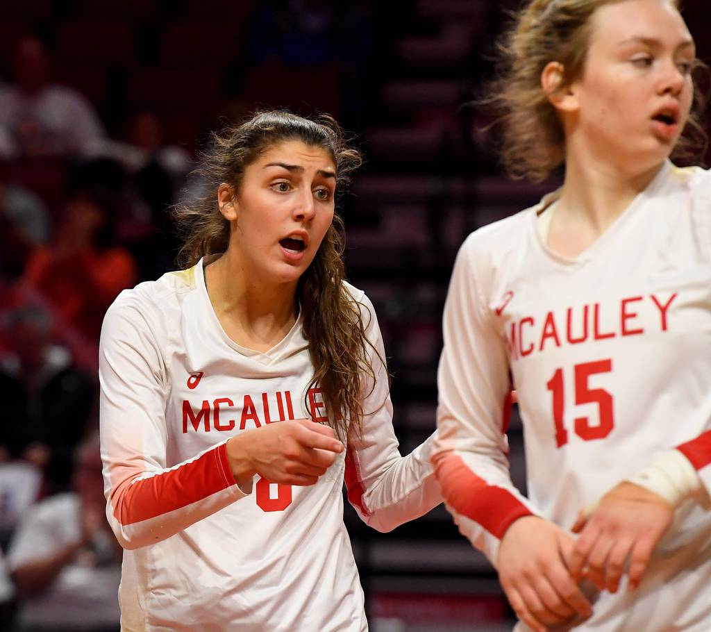 Mother McAuley's Ellie White (8) keeps her team energized against Benet during the Class 4A state championship match at Illinois State's Redbird Arena in Normal on Saturday, Nov. 12, 2022.