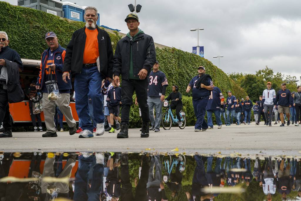 Fans walk toward Soldier Field before the Chicago Bears play the Houston Texans on Sept. 25, 2022.