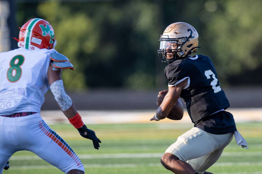 Richards' Dijon Newman (2) looks to pass against Morgan Park during a nonconference game in Oak Lawn on Friday, Aug. 25, 2023.
