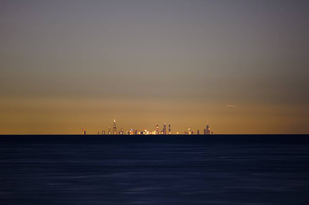 Light is emitted from the Chicago skyline as seen from Lake View Beach approximately 30 miles away in Beverly Shores, Indiana, on Feb. 1, 2023.