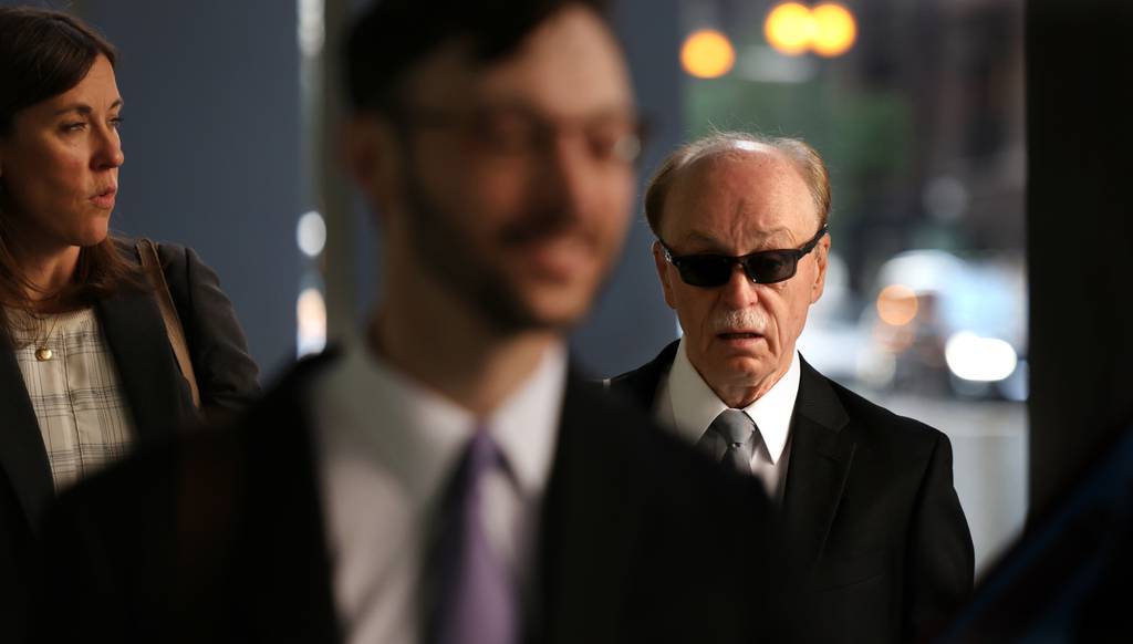 Tim Mapes, former chief of staff to House Speaker Michael Madigan, arrives with his attorneys at the Dirksen U.S. Courthouse in Chicago on Aug. 9, 2023, to face federal perjury charges.