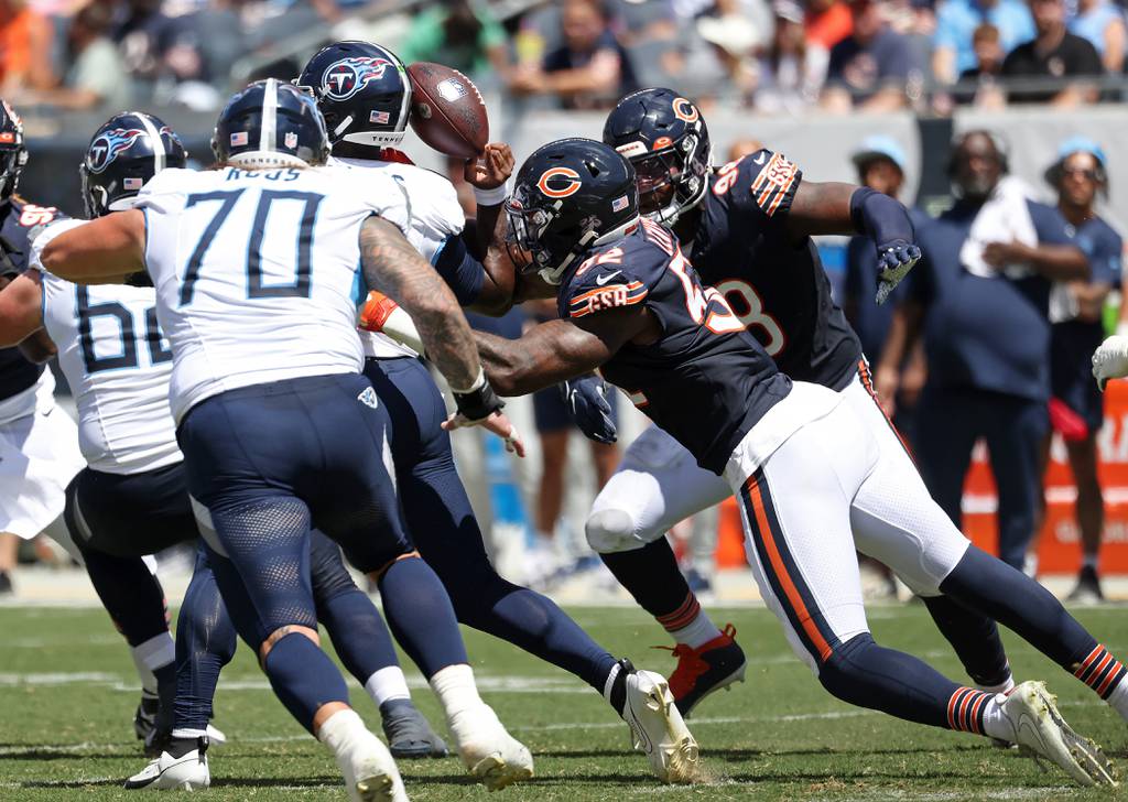 Bears linebacker Terrell Lewis strips the ball loose from Titans quarterback Malik Willis the second quarter of a preseason game at Soldier Field on Aug. 12, 2023.