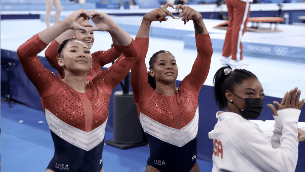 L to R Olympians Suni Lee (Auburn), Grace McCallum (Utah), Jordan Chiles (UCLA) as Simone Biles supports her teammates at Tokyo olympic games.