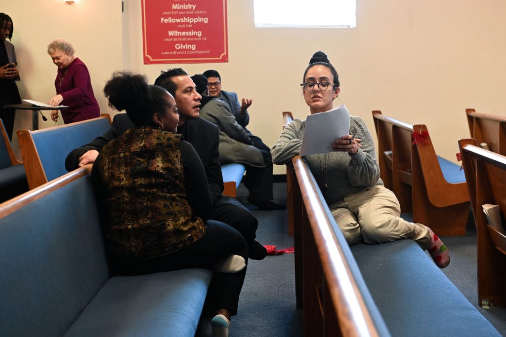 A Truth, Racial Healing & Transformation peace circle practitioner talks with participants on Dec. 9 at Concord Missionary Baptist Church in Woodlawn. Photo by Alexander Gouletas for The TRiiBE®