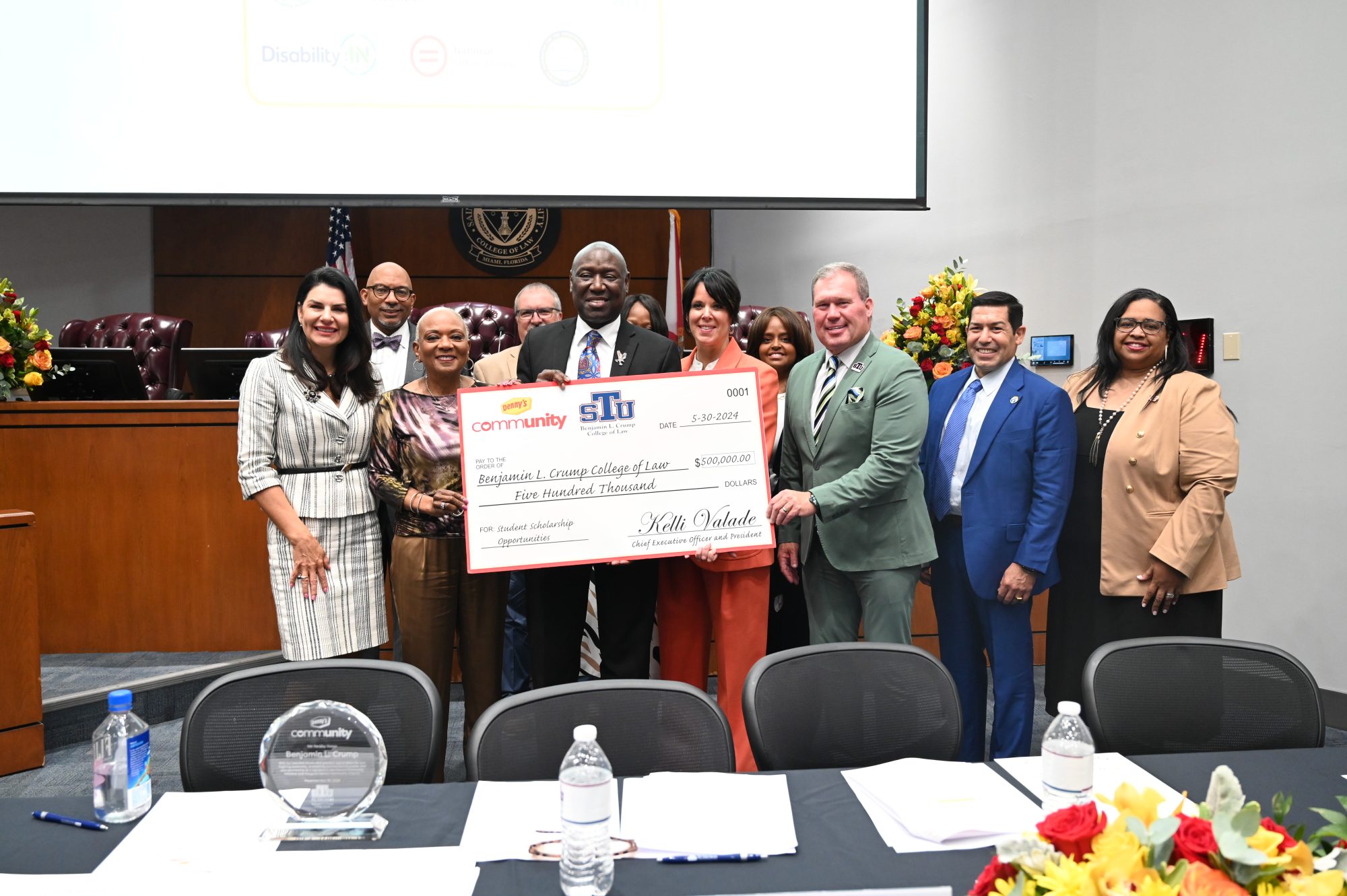 As part of Denny’s launch of its nationwide Community Alliance, a scholarship gift of $500,000 was given to the St. Thomas University Benjamin L. Crump College of Law. Crump accepted the donation from Denny’s in support of the College of Law’s commitment to social justice.Pictured (l-r): Dean Tarlika Nunez-Navarro, Benjamin L. Crump College of Law; Randy Brown, Denny’s Senior Manager, Business Diversity; Brenda J. Lauderback, Chair, Board of Directors, Denny’s Inc.; Michael Whitacre, Denny’s Director of Franchise Operations; Benjamin L. Crump; Gail Sharps Myers, Denny’s Executive Vice President, Chief Legal and Administrative Officer; Kelli Valade, Denny’s CEO and President; Fasika Melaku-Peterson, Denny’s Senior Vice President, Chief Learning and Development Officer; President David A. Armstrong, St. Thomas University; Nader Talebzadeh, Denny’s Director of International Operations; April Kelly-Drummond, Denny’s Vice President, Chief Inclusion and Community Engagement Officer