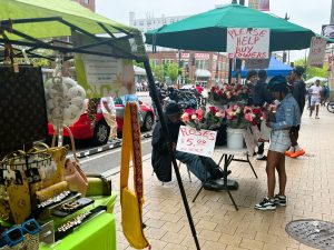 Black and Hispanic street vendors, positioned along the street in front of Target, expressed worry that decreased foot traffic from sustained boycotting will affect their ability to make a living, and possibly put them out of business. (Photo/Dr. Patrise Holden)