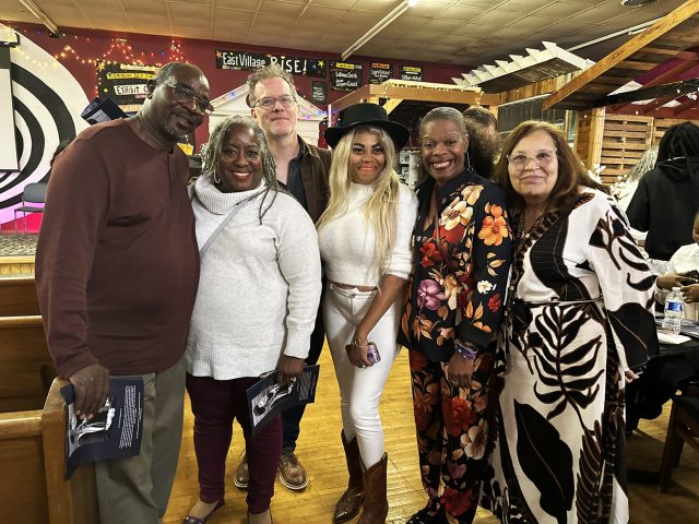 From left: David Stewart, Wilma Stewart (Note: Wilma Stewart is Sun Ra’s niece), Burgin Mathews, Oneika Brooks DeJoy, Rene Kemp-Rotan, and Stephonia Taylor McLinn pose for a photograph at Cassadra Griffen’s memorial service at East Village Arts on Nov. 9, 2025. (Shauna Stuart, For The Birmingham Times)