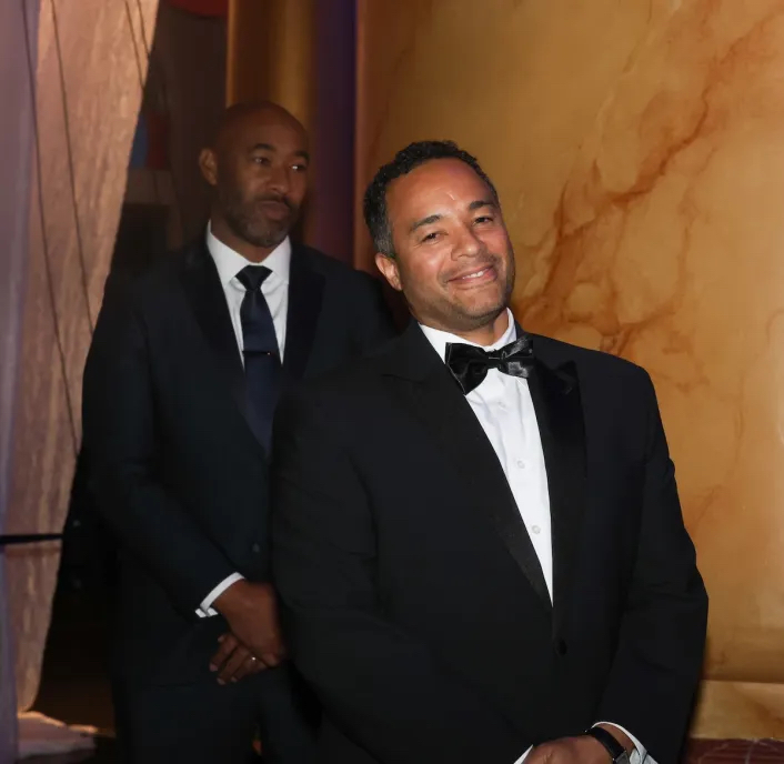 Brian Kenner (right), global head of community engagement for Amazon, poses before accepting his award at the D.C. Chamber of Commerce’s 2025 Awards and Gala on Nov. 6 at the National Building Museum in Northwest D.C. (Shevry Lassiter/The Washington Informer)