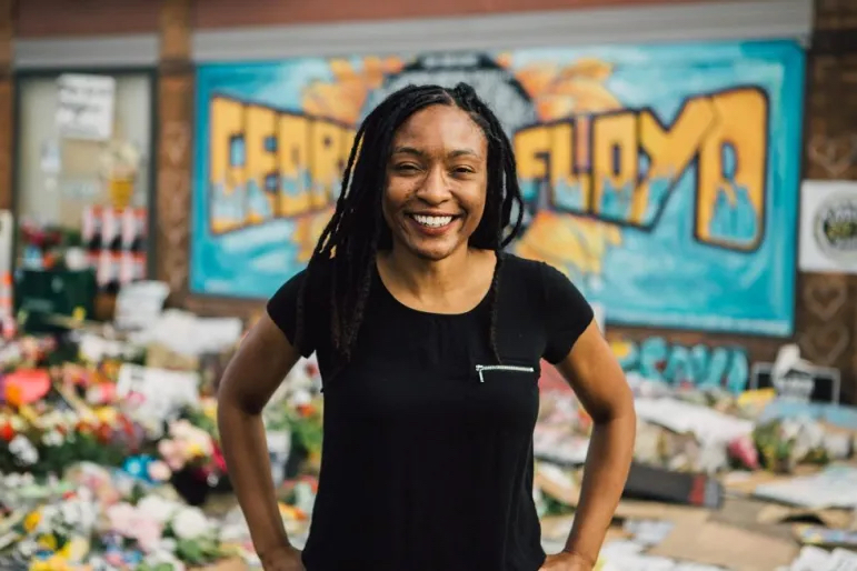 Jeanelle Austin, executive director of Rise & Remember, poses in George Floyd Square. Credit: Photo by Isaiah Rustad