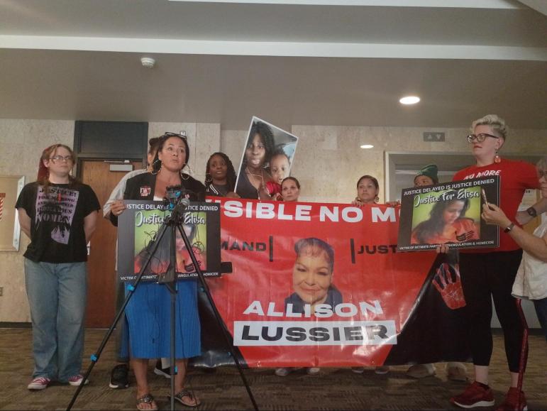 Jana Williams speaks to reporters after City Auditor Robert Timmerman revealed systemic missteps in MPD investigations into the deaths of Allison Lussier and Davis Moturi.