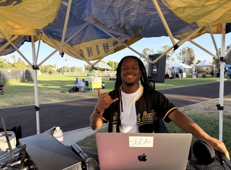 Jelani “DJ Lani” Luke plays music during Frat Games at Darby Park in Inglewood, Calif., on Saturday, July 25. (Daniele Lawson / L.A. Sentinel)
